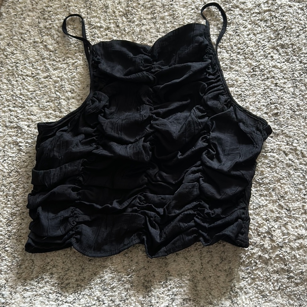 H&M spaghetti strapped top with a stretchy fit.
